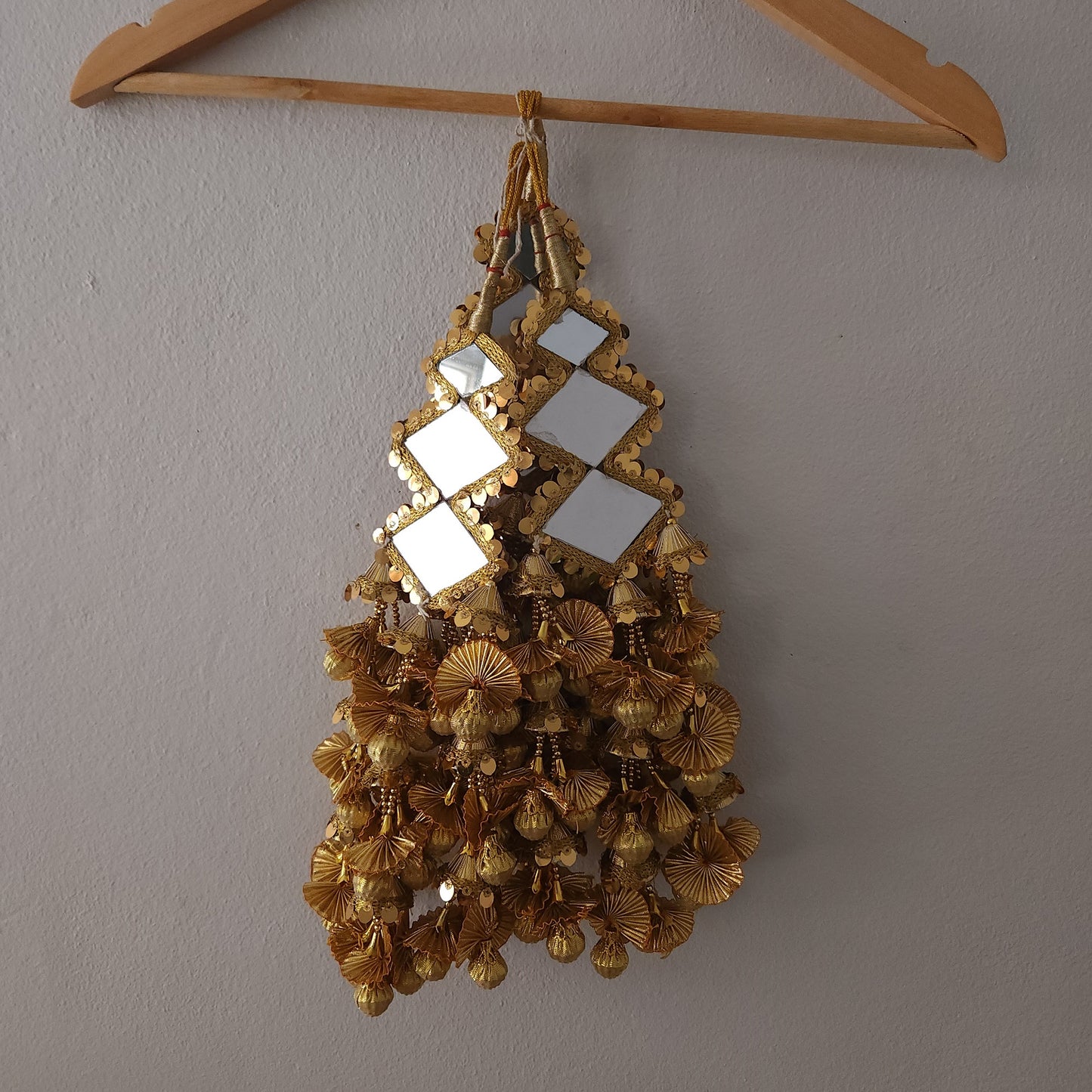 golden-color-three-big-mirrors-diamond-shaped