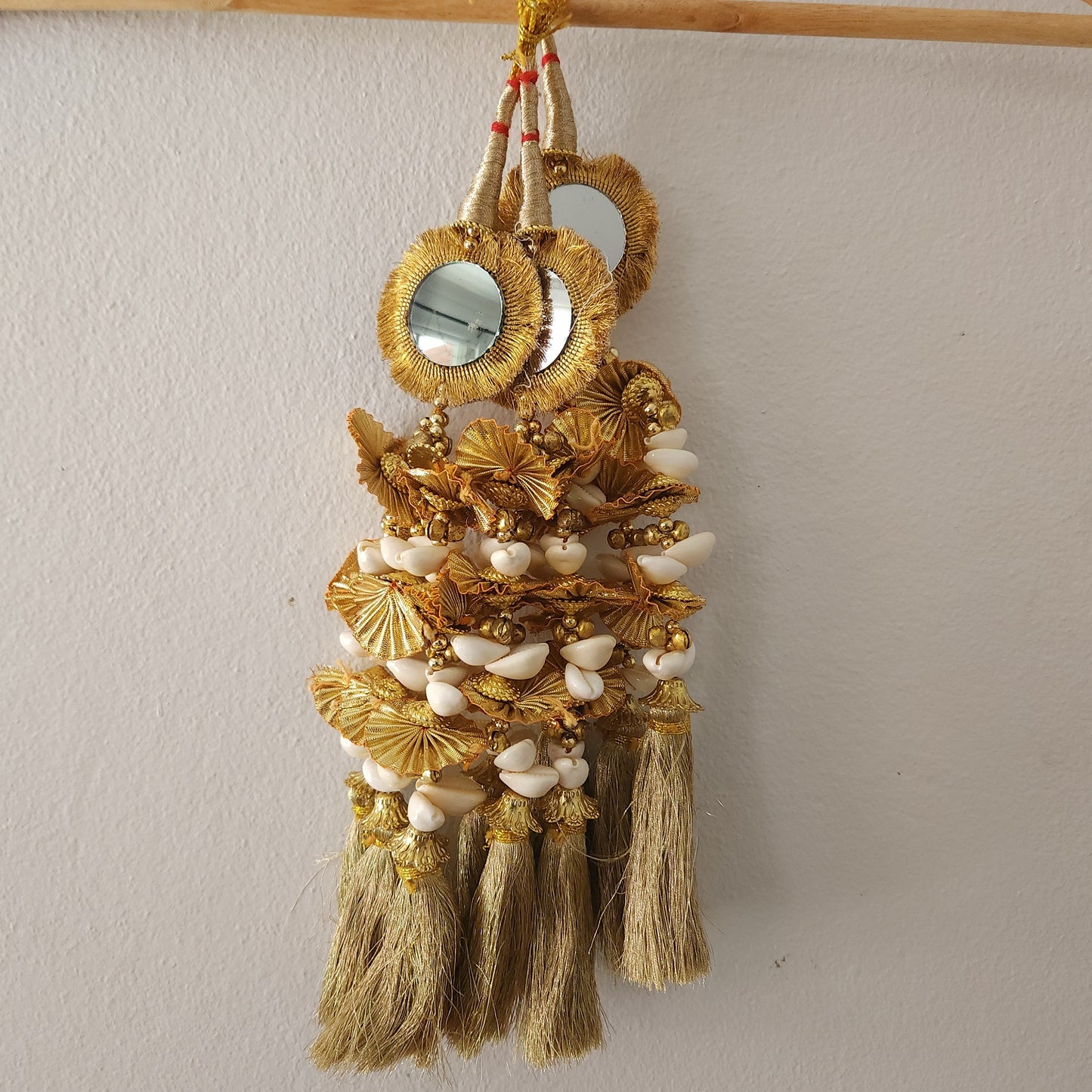 golden-color-kaudi-design-big-mirrors-circle-shape