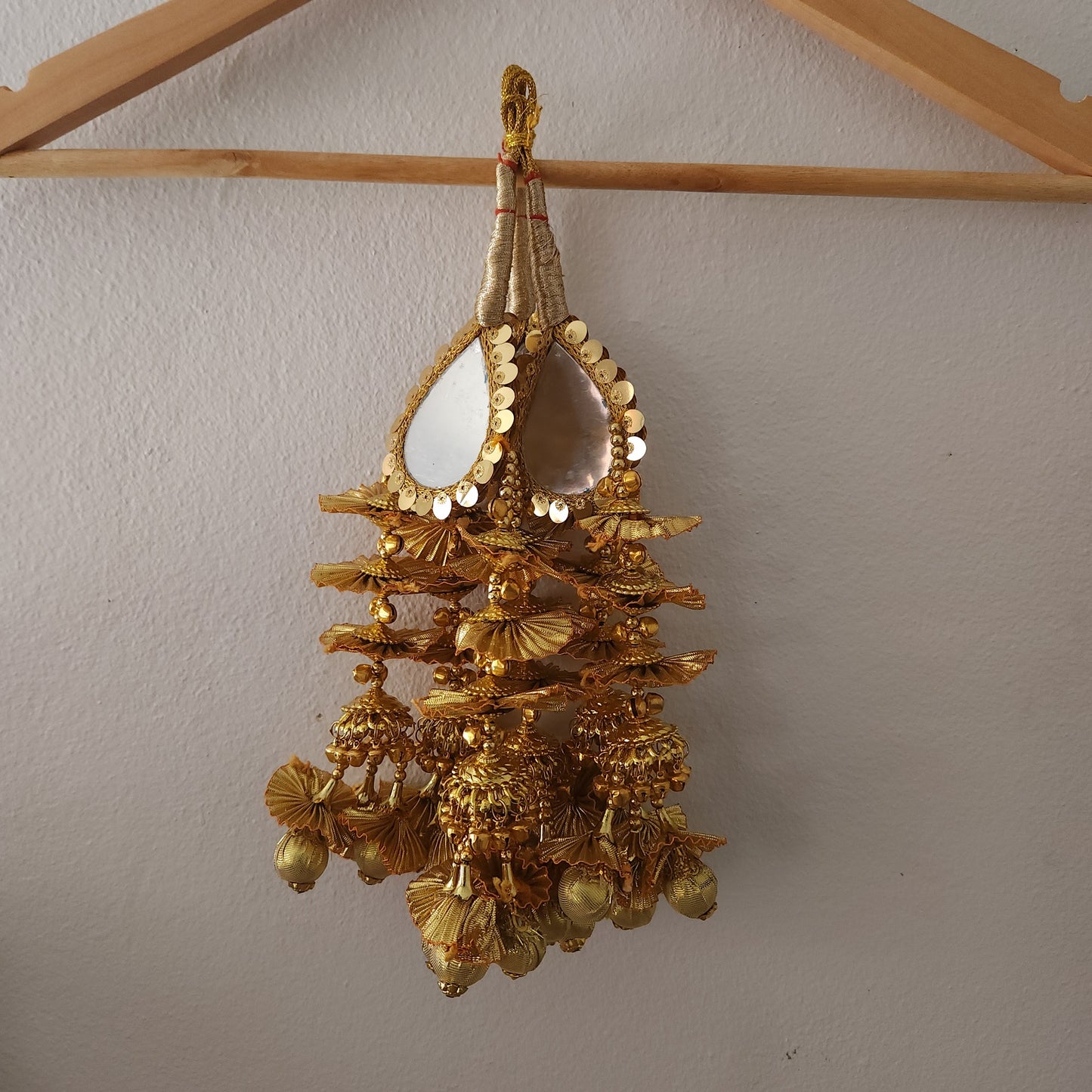golden-color-raindrop-shape-big-mirror-design