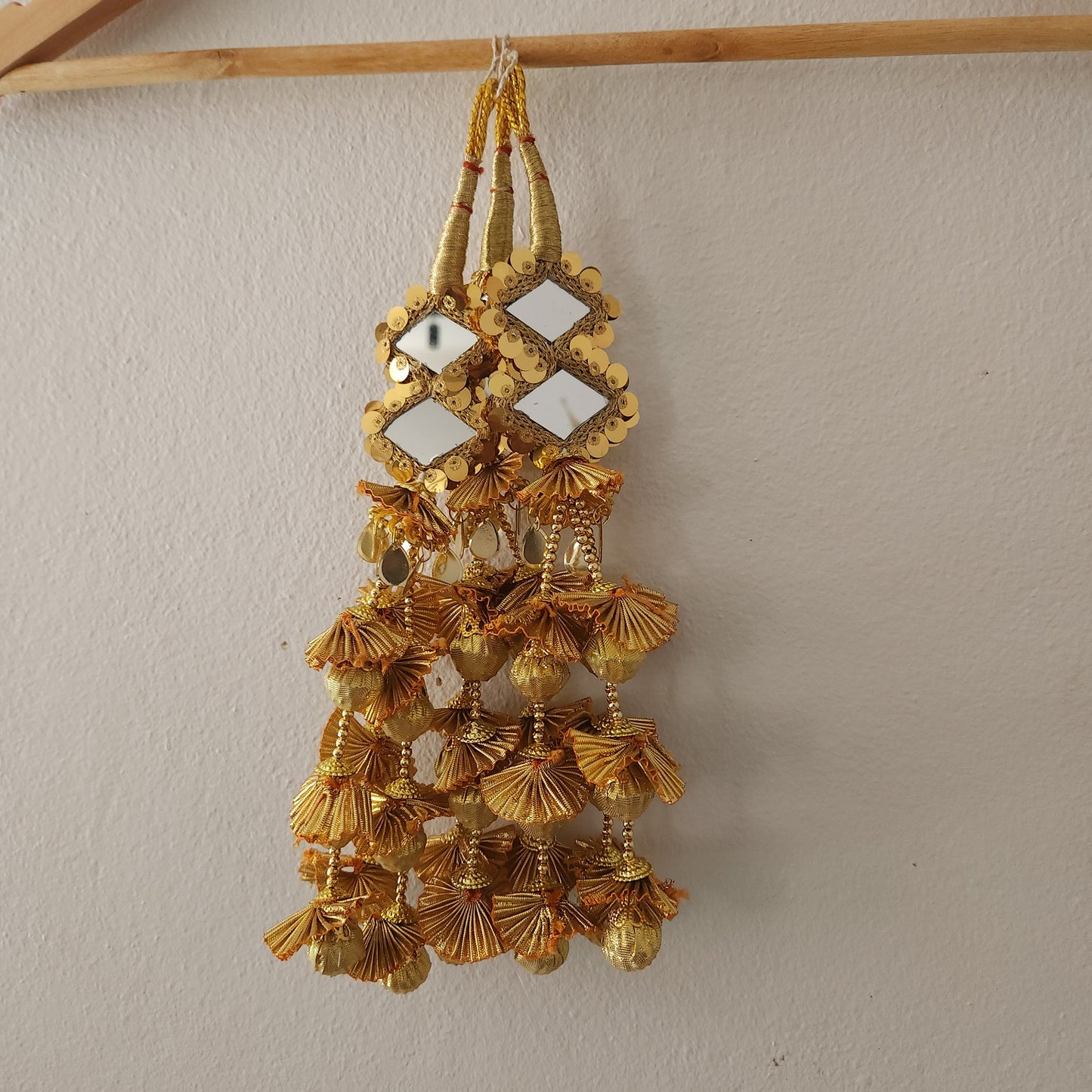 golden-colour-gotta-design-two-diamond-shaped-mirrors